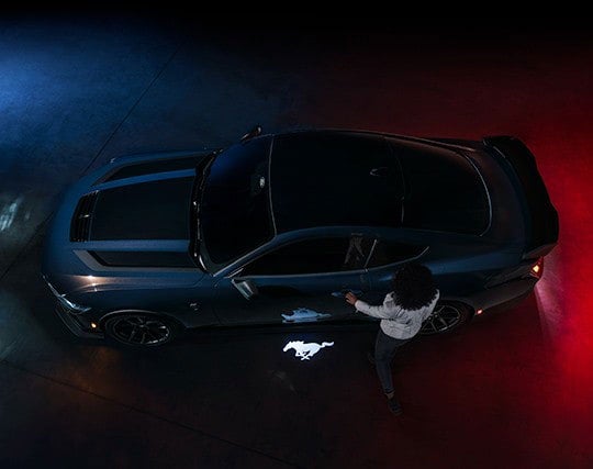 2024 Ford Mustang® Dark Horse™ model with a driver approaching the vehicle | Leif Johnson Ford of Buda in Buda TX