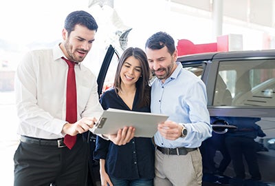 People looking at clipboard